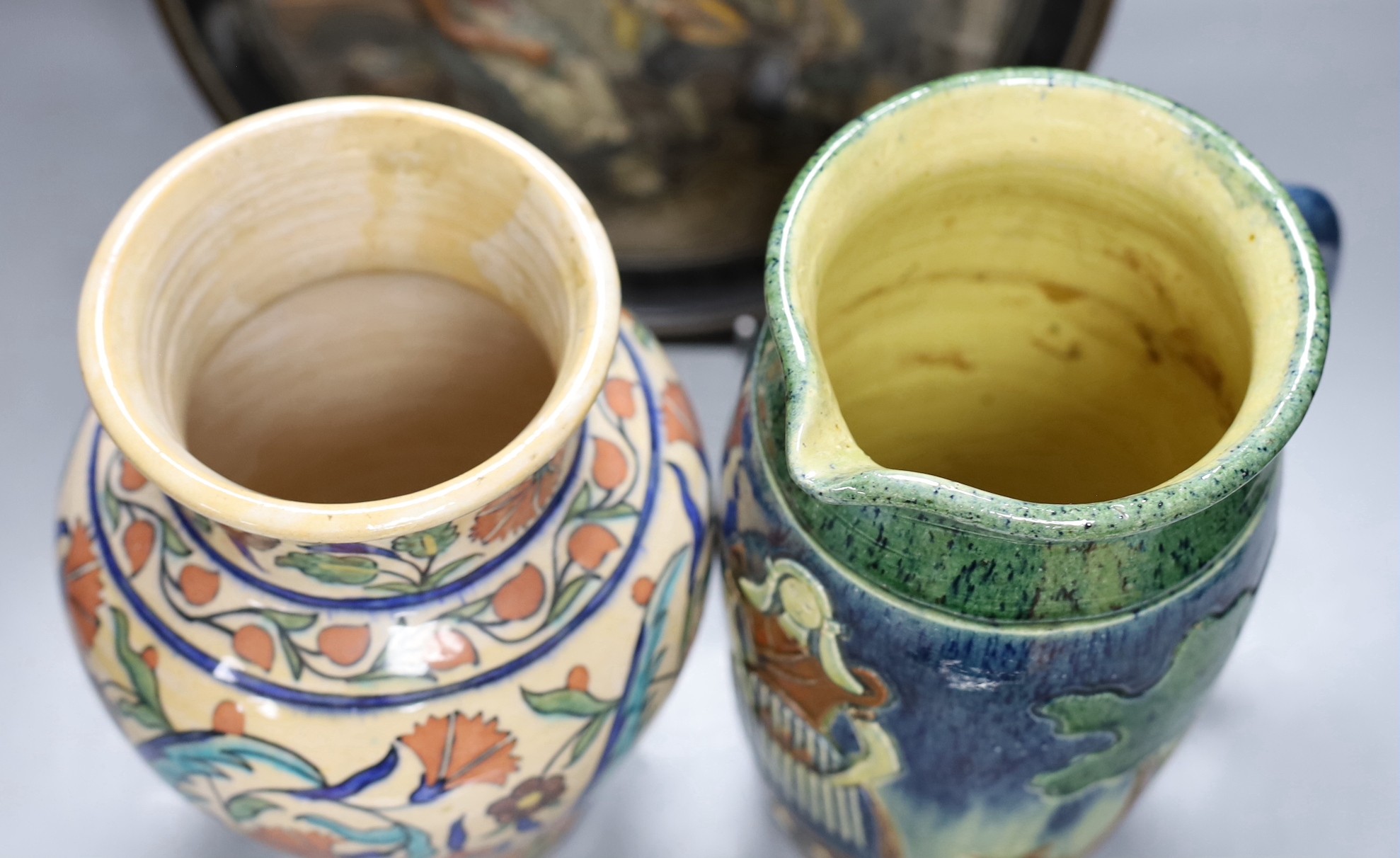 A Dutch jug, a polychrome vase and a Maresch Musterschutz moulded wall plaque, 33 cm diameter